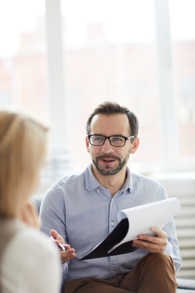 therapist sitting with a client