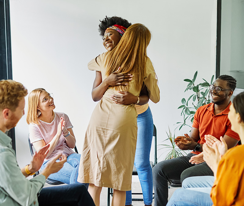 People participate in therapy at an addiction treatment center.