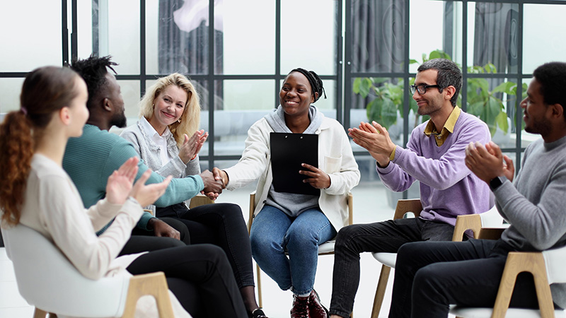 People participate in therapy at a mental health treatment center.