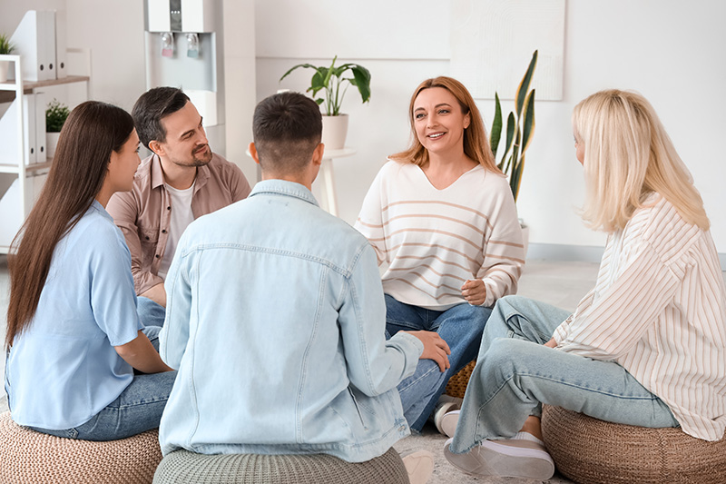 People participate in therapy at a mental health treatment center.