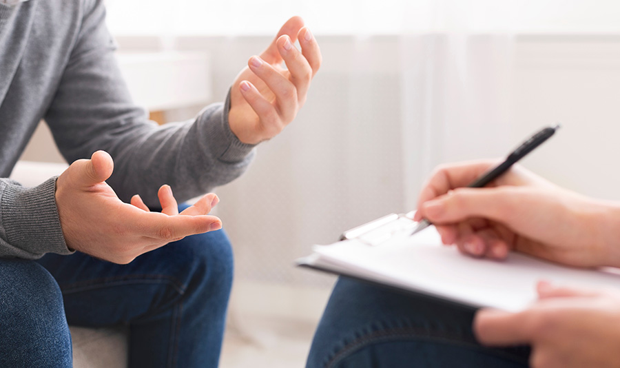 A person participates in therapy at a mental health treatment center.