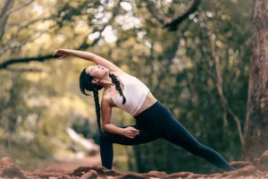 A person practices yoga as part of a holistic approach to relapse prevention.